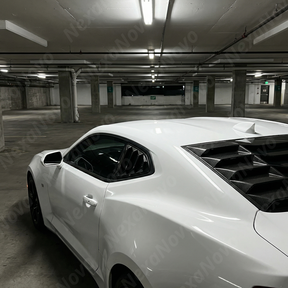 Full side profile of a 2018 Chevrolet Camaro featuring NexaNovo carbon fiber print side quarter window covers