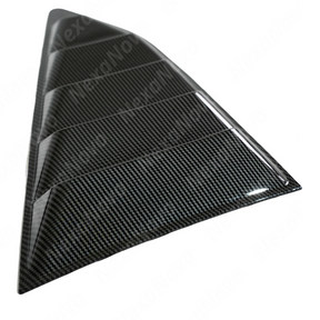 Low angle view emphasizing the muscular racing aesthetic of NexaNovo carbon fiber side window shades