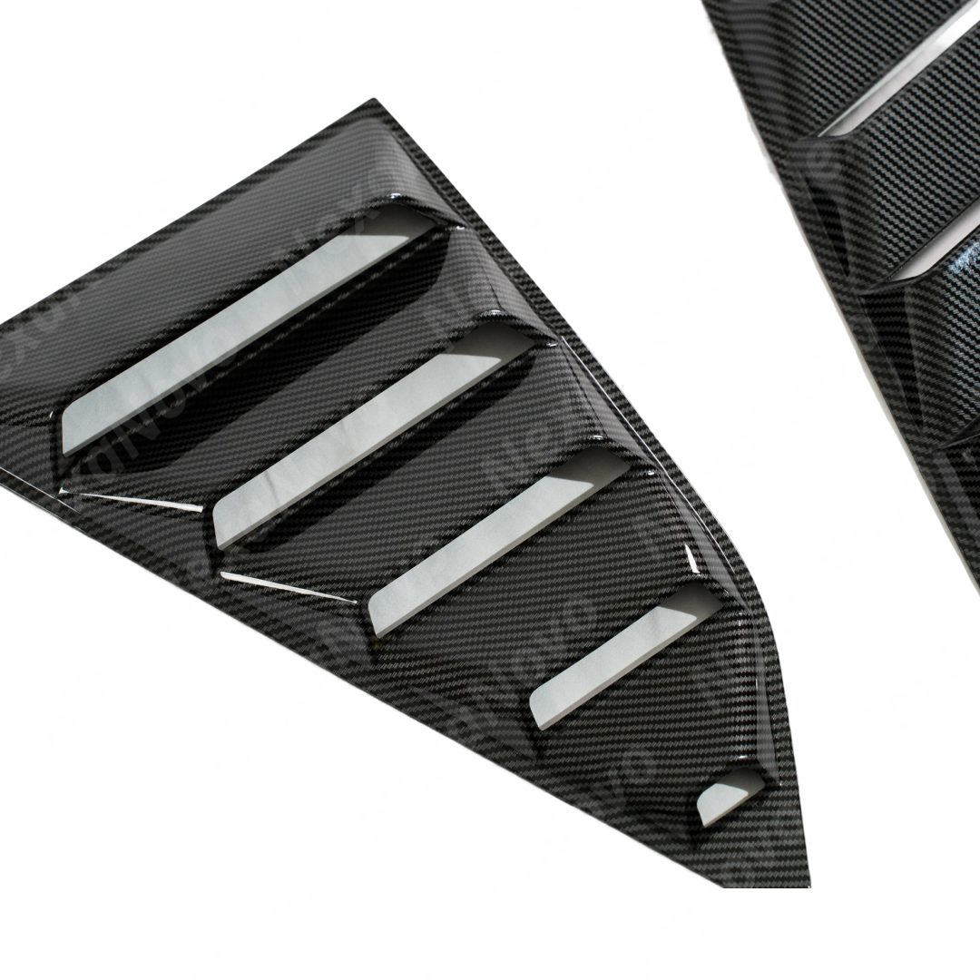 NexaNovo carbon fiber print side quarter window louvers providing sharp contrast on a white 6th Gen Camaro
