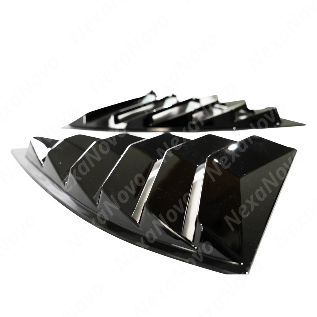 2014 Chevrolet Camaro in motion featuring the aggressive gloss black louver