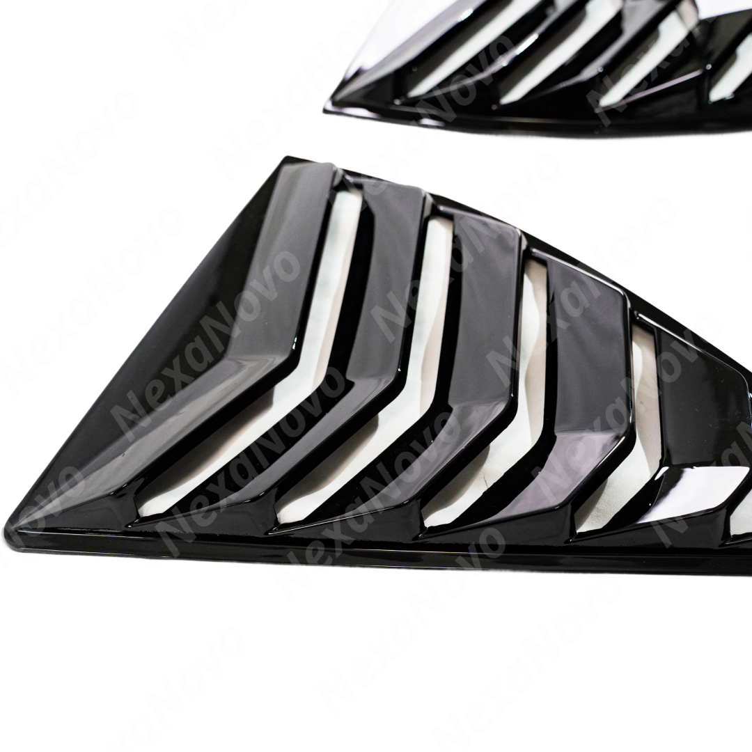 Looking out from the interior of the Camaro through the rear window louver slats