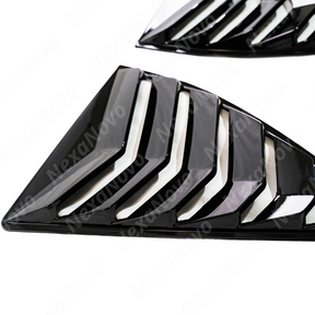 Looking out from the interior of the Camaro through the rear window louver slats