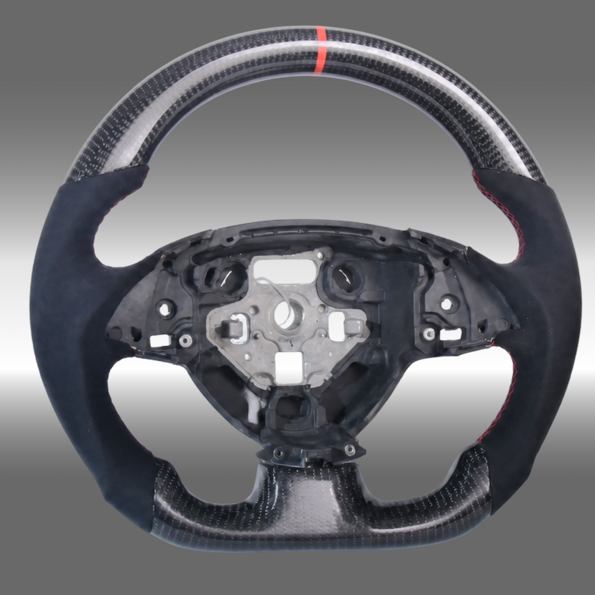 Custom 3K gloss carbon fiber sport steering wheel with black Alcantara grips and red center stripe installed in a Chevy Camaro cockpit