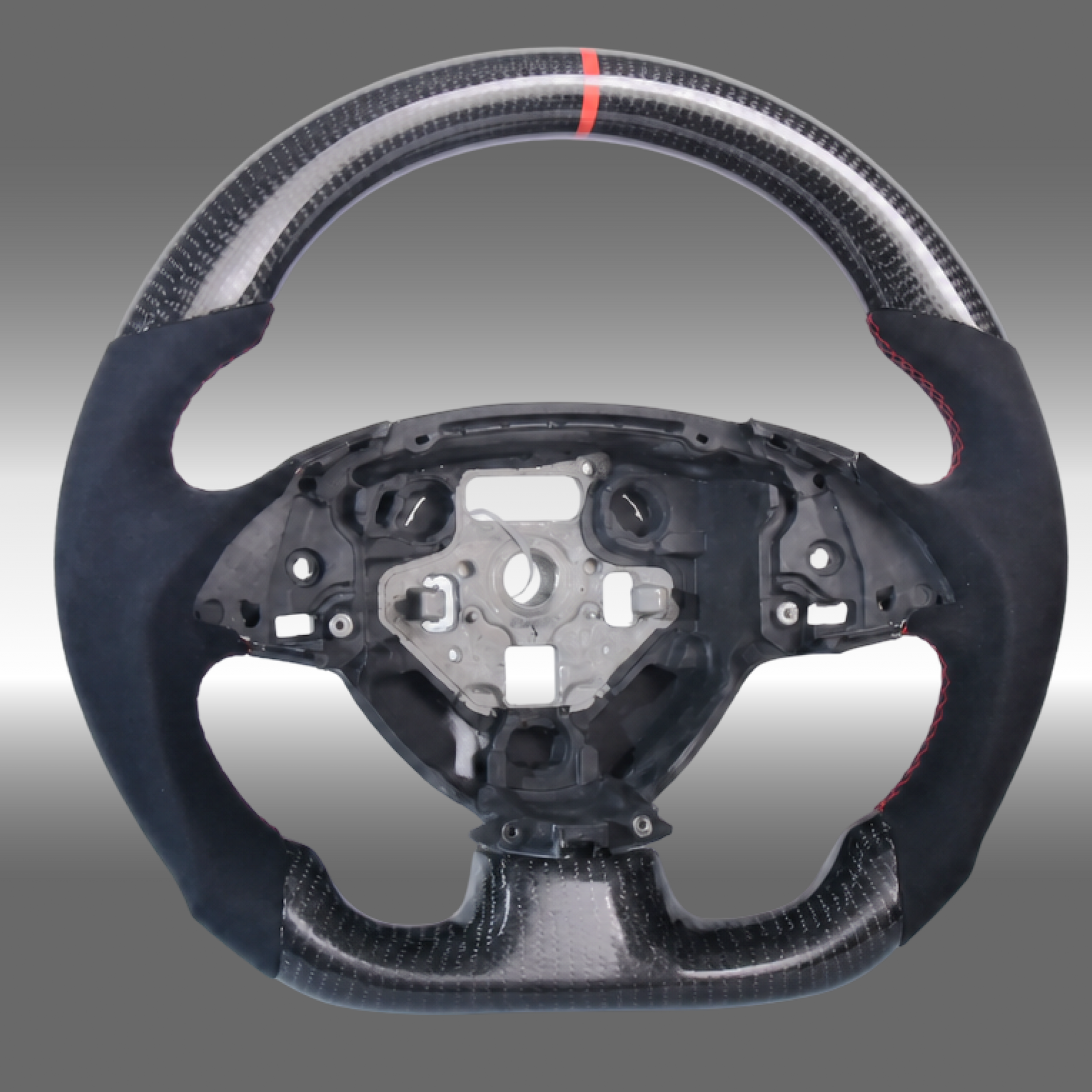 Custom 3K gloss carbon fiber sport steering wheel with black Alcantara grips and red center stripe installed in a Chevy Camaro cockpit