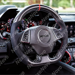 Driver seat view highlighting the track-inspired carbon fiber steering wheel integrated with the digital driver cluster