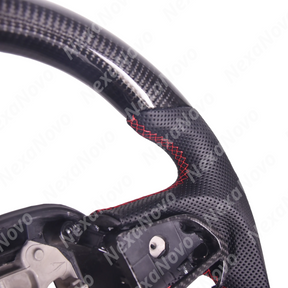 Direct front driver perspective highlighting the D-cut flat-bottom racing shape and red 12 o'clock center alignment line on a Chrysler 300