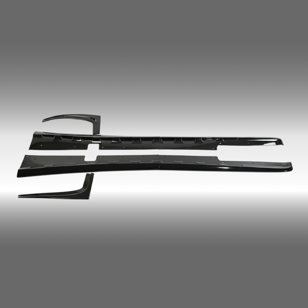 NexaNovo ZR1 style glossy black side skirt rocker panel pair installed on a 1997 Chevrolet Corvette C5