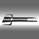 NexaNovo ZR1 style glossy black side skirt rocker panel pair installed on a 1997 Chevrolet Corvette C5