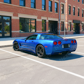 Uninstalled NexaNovo ZR1 style glossy black side skirt rocker panel pair