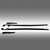 NexaNovo ZR1 style gloss black side skirt rocker panel and mud flaps installed on a 2005 Chevrolet Corvette C6