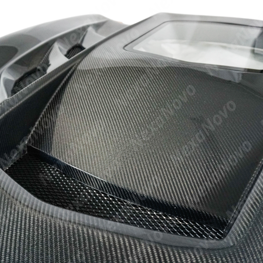 NexaNovo carbon fiber hood integrated on a black Chevrolet Corvette C7