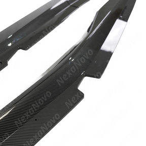 Carbon fiber car part with visible texture on a white background