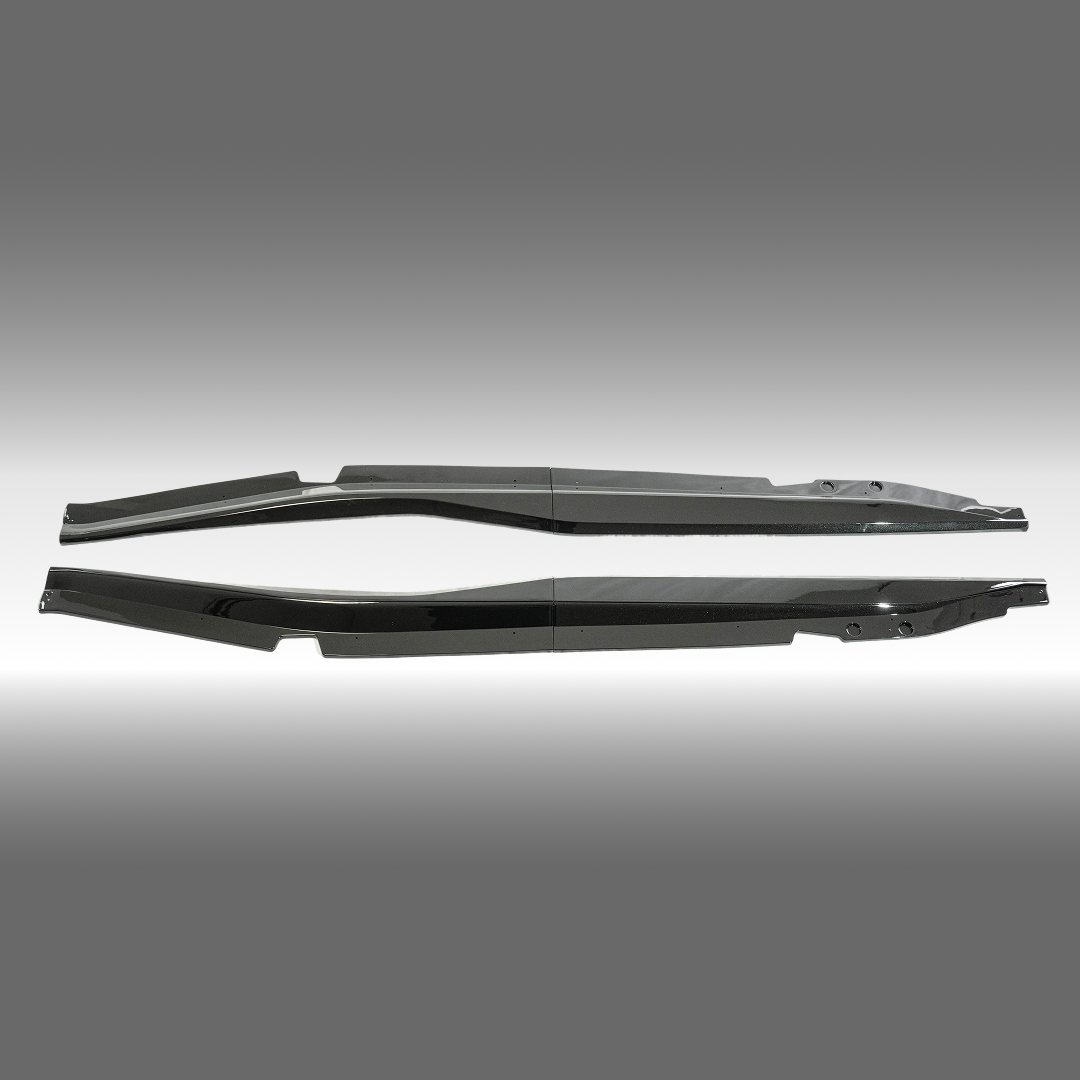 NexaNovo Z06 style gloss black side skirt extensions installed on a 2014 Chevrolet Corvette C7