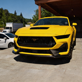 Direct front view highlighting the low-slung, track-ready stance of the NexaNovo carbon splitter