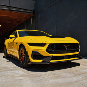 Low-profile track-level shot showing the prominent aerodynamic sculpture of the NexaNovo front lip