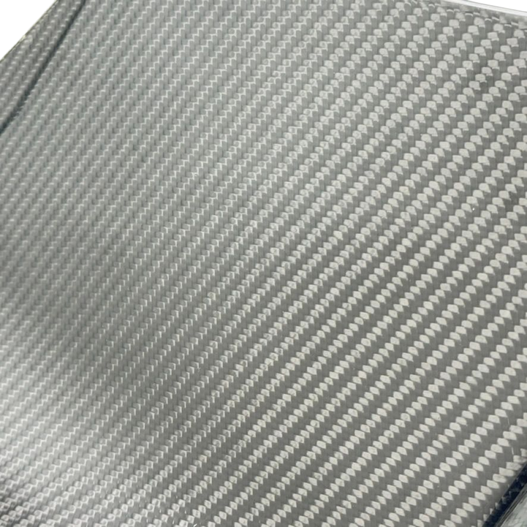 Stealth performance aesthetic of the real carbon splitter accenting a Shadow Black 2025 Mustang S650