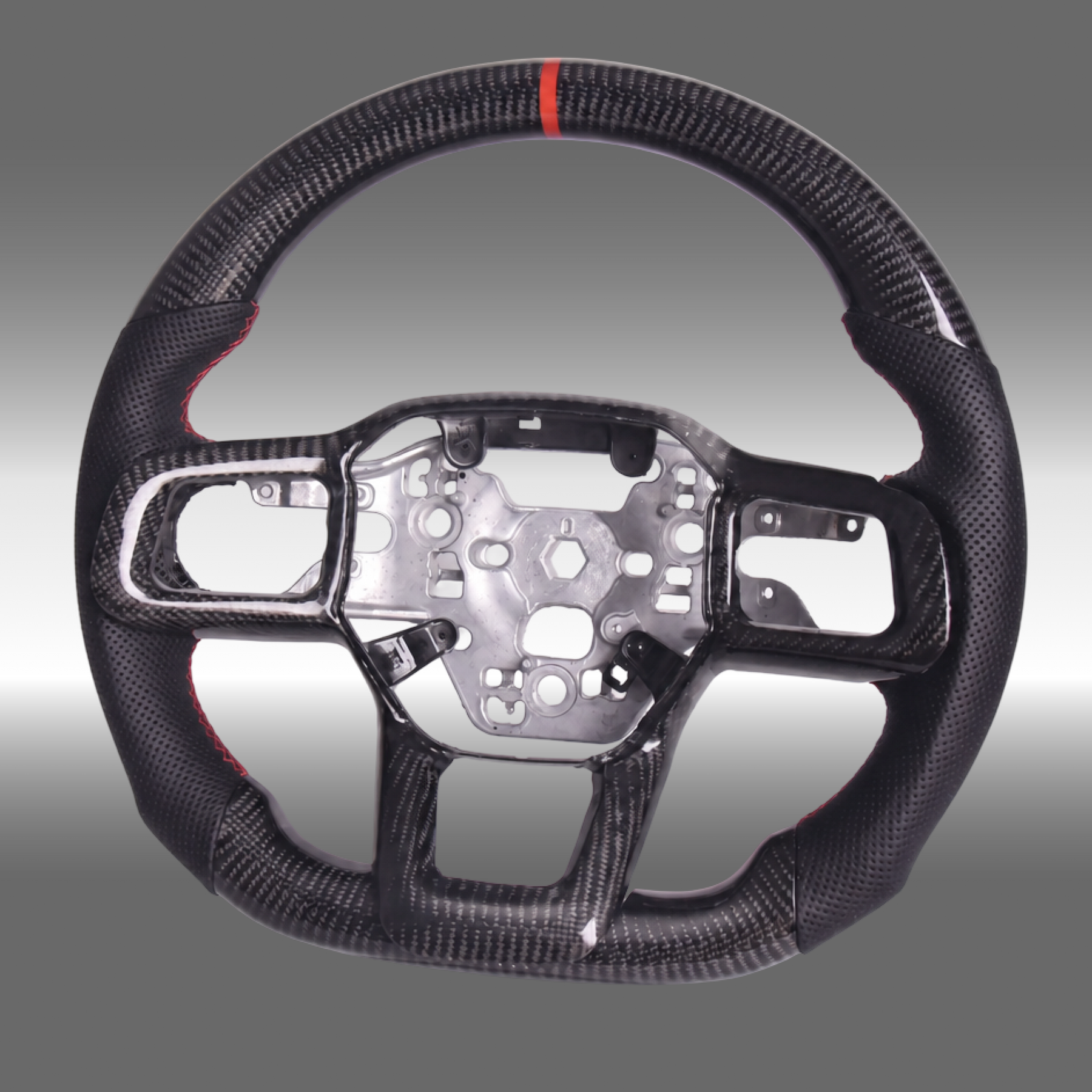 Custom 3K gloss carbon fiber sport steering wheel with perforated leather and red center stripe installed in a 2024-2027 Ford Mustang S650 cockpit