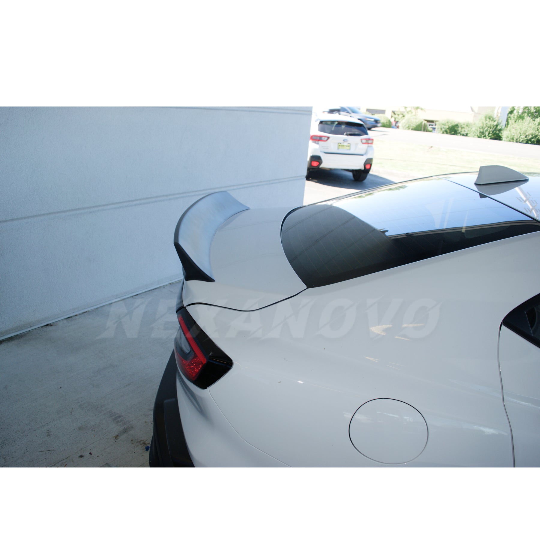 Installation view of the Duck Bill Low Profile Spoiler on the WRX STI 2022-2024, demonstrating the seamless integration with the vehicle's design.