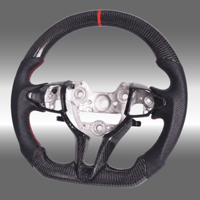 Custom 3K gloss carbon fiber sport steering wheel with perforated leather and red center stripe installed in an Elantra N cockpit
