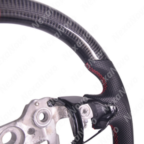 Direct front driver perspective showcasing the D-cut flat-bottom racing shape and red 12 o'clock center alignment line