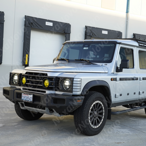Heavy-duty NexaNovo stainless steel front light covers accenting the classic off-road look of a Mushroom White Grenadier