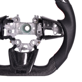 Side angle view demonstrating clearance for OEM paddle shifters behind the thickened leather hand grips