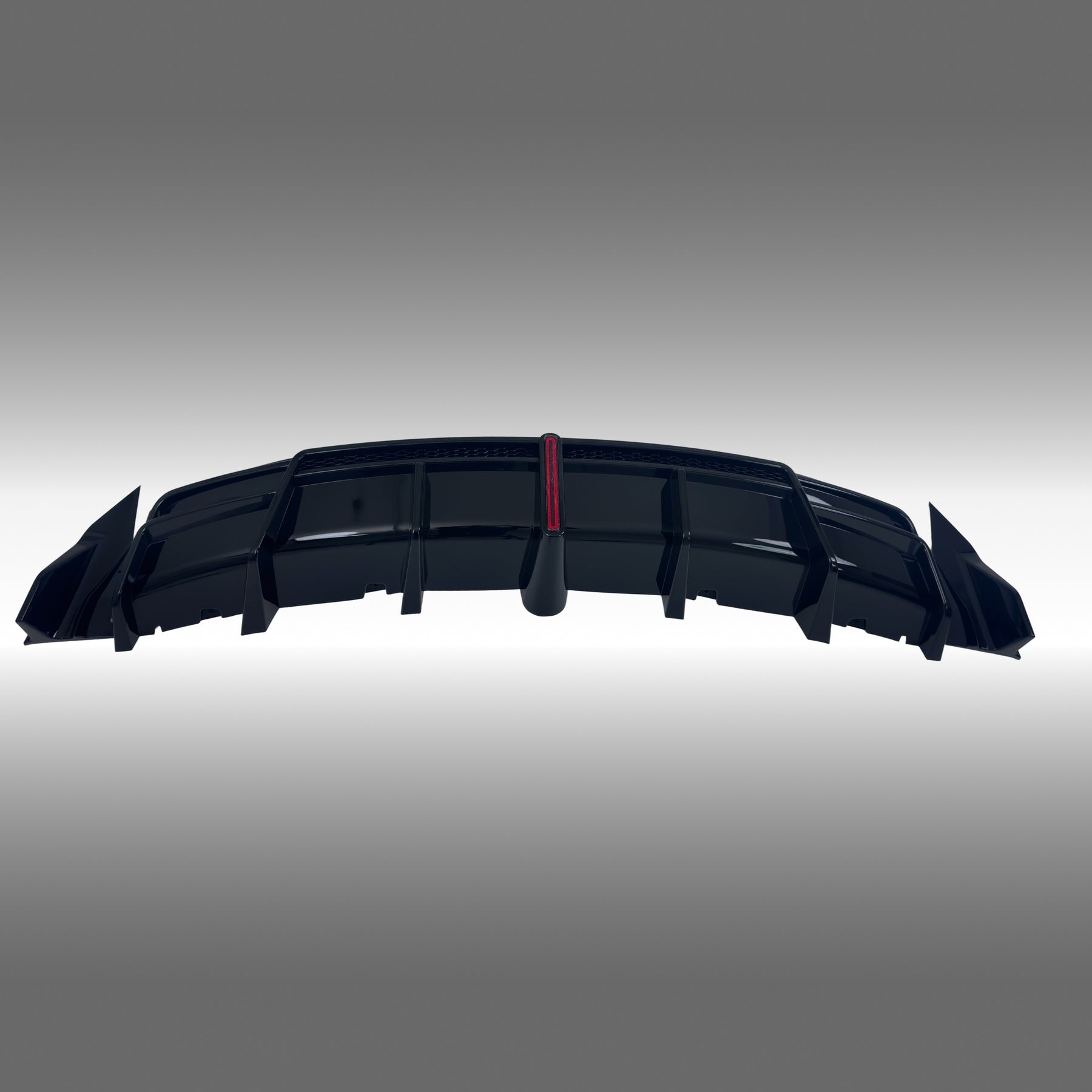 NexaNovo VTEN style gloss black rear diffuser with integrated LED brake light installed on a 2017-2023 Tesla Model 3