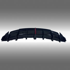 NexaNovo VTEN style gloss black rear diffuser with integrated LED brake light installed on a 2017-2023 Tesla Model 3
