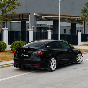 Direct rear perspective highlighting the aggressive vertical aero fins and centered F1-style LED third brake light