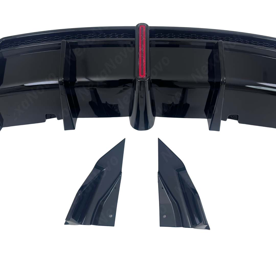 Detailed macro shot of the sculpted vertical diffuser aero fins and piano gloss black finish