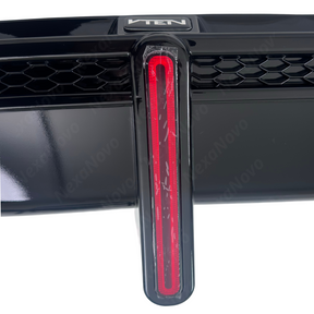 Nighttime view demonstrating active illumination of the integrated red LED running light and brake strobe