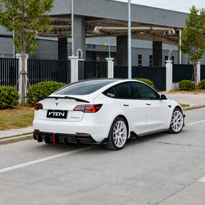 Direct side profile showcasing the extended aerodynamic rocker panel blades and lowered visual stance