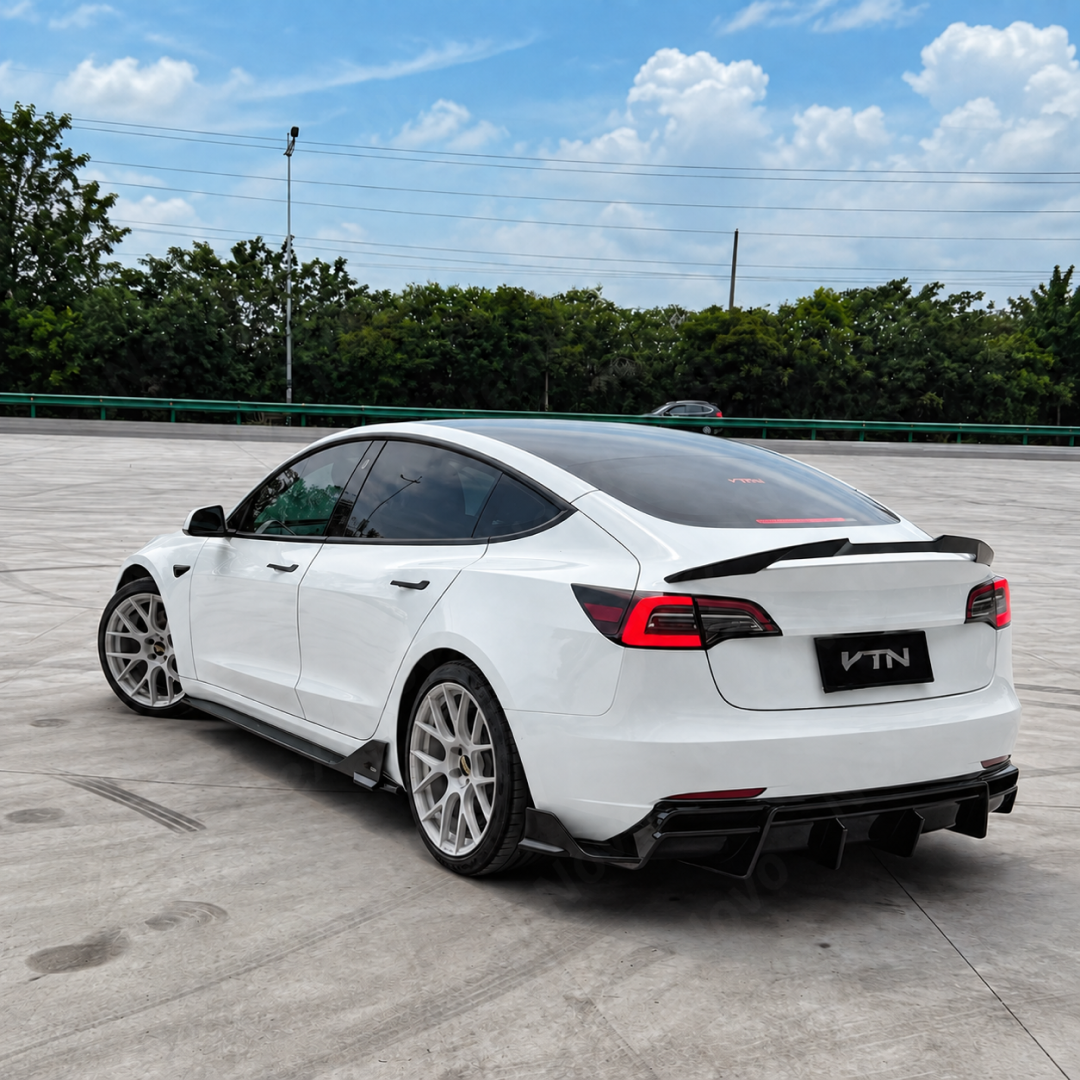 High-contrast styling of piano gloss black VTEN side skirts mounted on a Pearl White Multi-Coat Tesla Model 3
