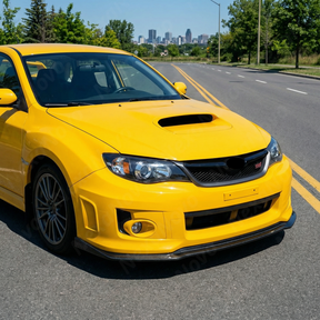 Front-end shot emphasizing the widened, aggressive track stance of the STI with NexaNovo aero