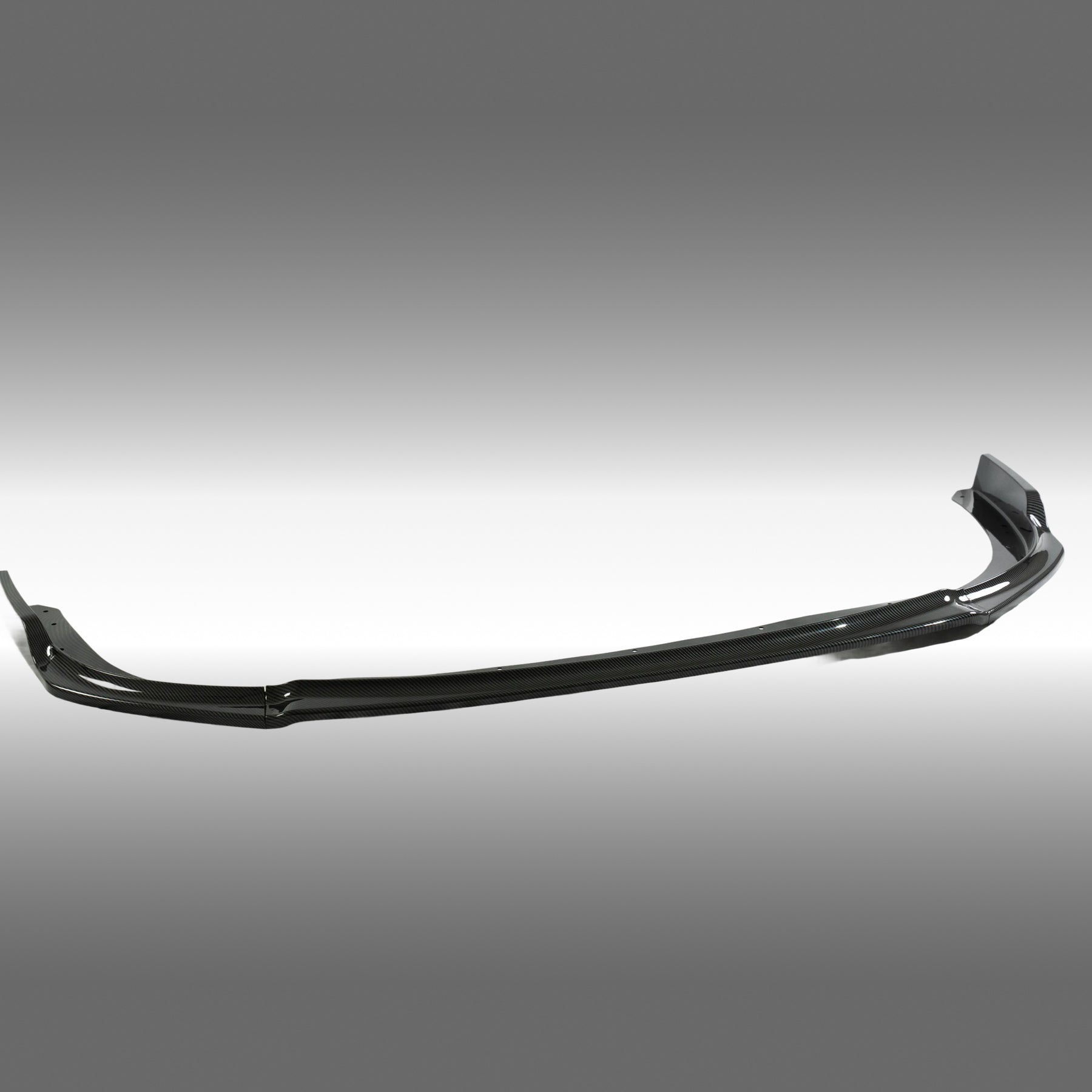 Close-up of the high-definition carbon fiber print weave on the NexaNovo Subaru STI front lip