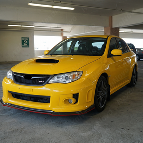NexaNovo carbon fiber print front lip with red accent installed on a 2008 Subaru Impreza WRX STI