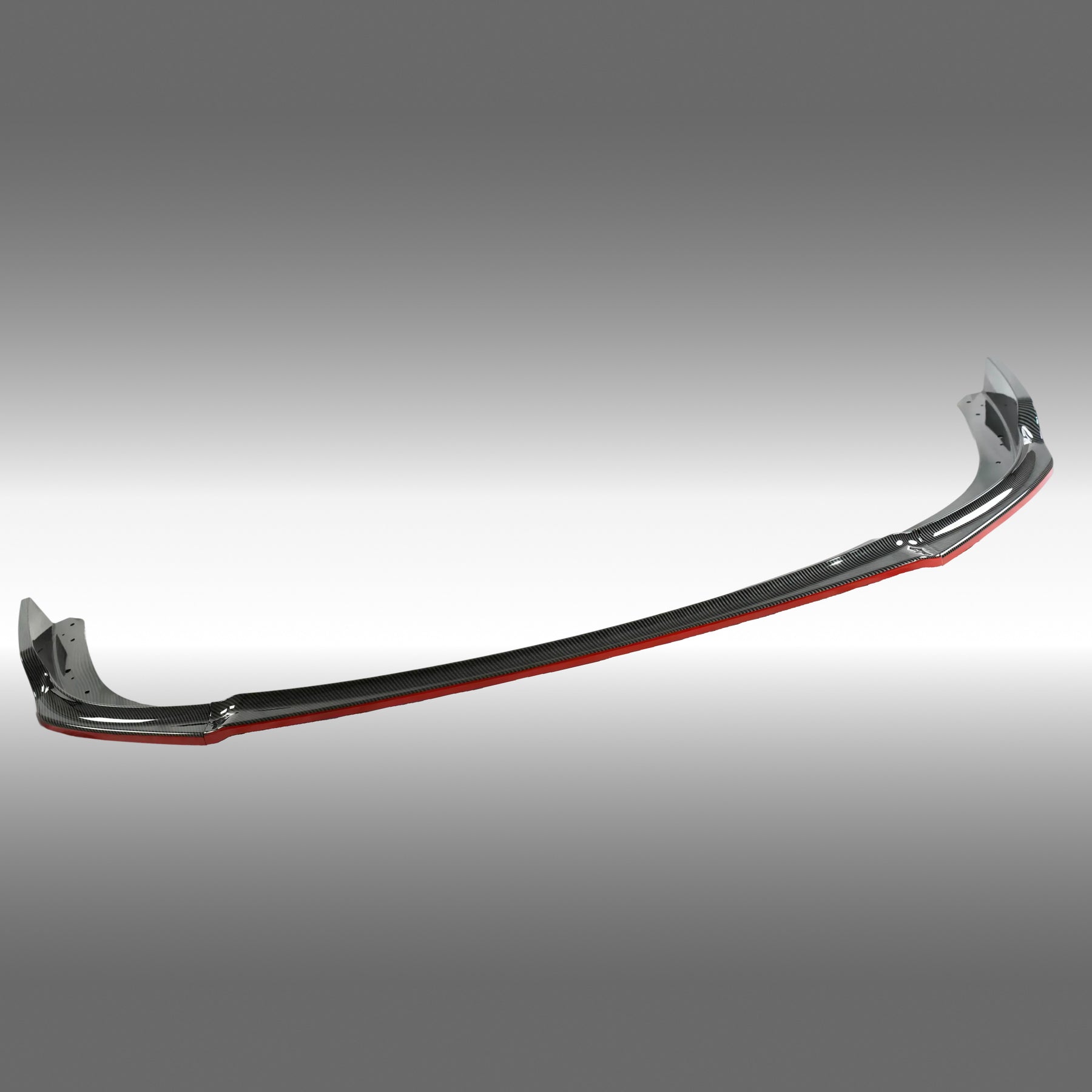 Standalone view of the uninstalled NexaNovo carbon fiber print front lip with red pinstriping