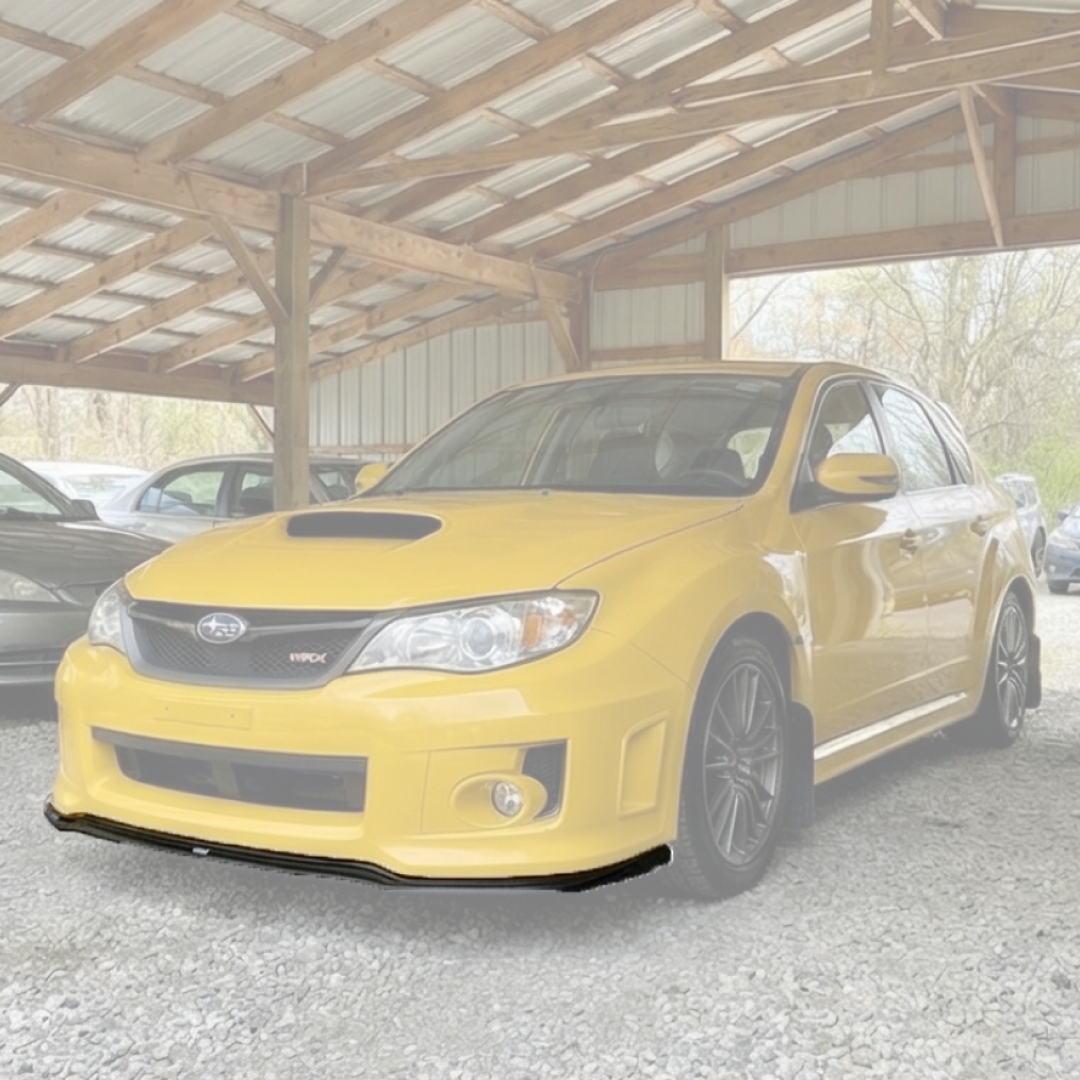 Close-up of the mirror-like gloss black finish on the NexaNovo Subaru STI front lip