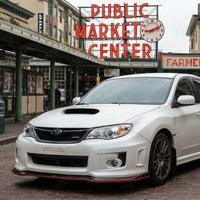 High-contrast look of the carbon fiber and red splitter on a Satin White Pearl Subaru STI
