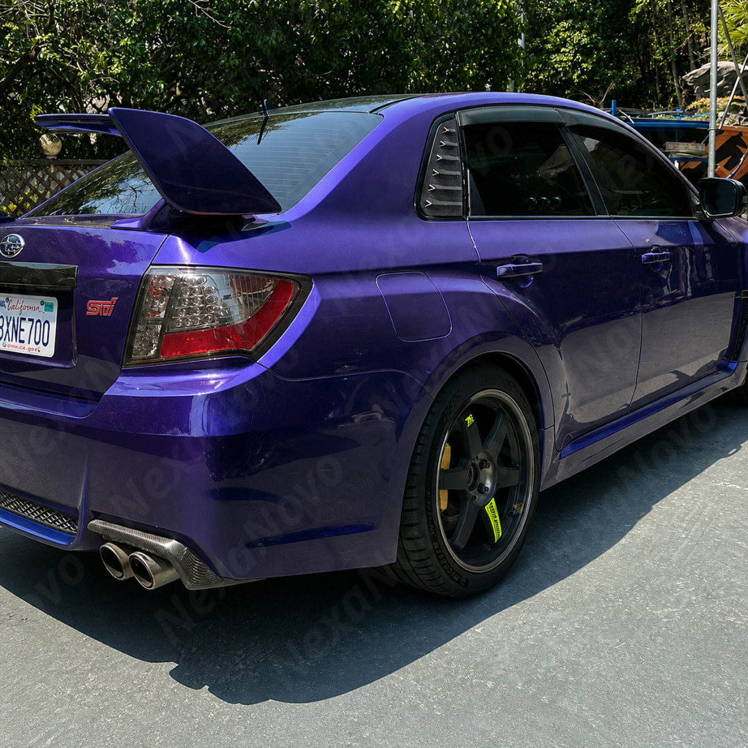 Aggressive carbon print rear side window louvers installed on a 2013 Subaru WRX STI sedan