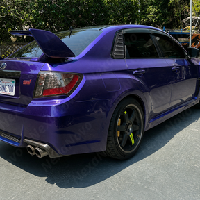 Aggressive carbon print rear side window louvers installed on a 2013 Subaru WRX STI sedan