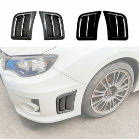 Close-up showing the precision fitment of the replacement vents against the STI bumper housing