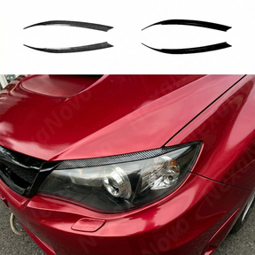 Aggressive carbon print headlight accent trim installed on a 2012 Subaru WRX STI