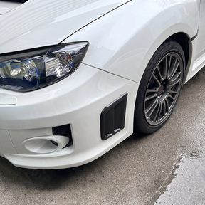 Performance aesthetic of gloss black side vents on a 2013 Subaru STI hatchback (GR)
