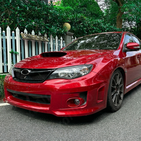 Pair of gloss black headlight eyelid overlays installed on a 2011 Subaru WRX STI GV sedan