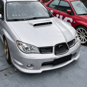Outdoor shot of the Hawkeye STI featuring the complete gloss black grill transformation