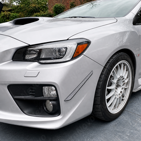 Aggressive carbon print front bumper aero canards installed on a 2016 Subaru WRX STI