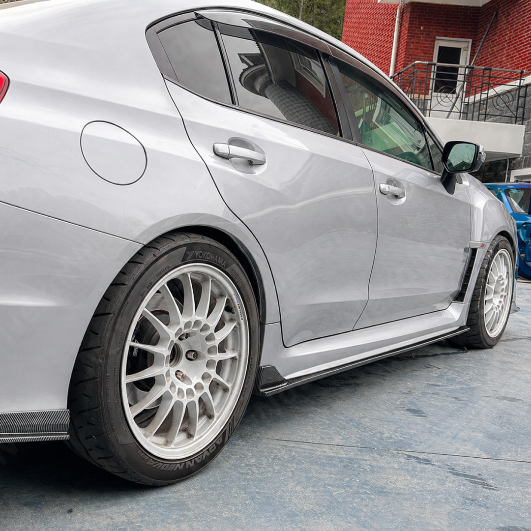 Aggressive carbon print JDM style side skirts installed on a 2017 Subaru WRX STI
