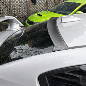 Aggressive carbon print rear window spoiler installed on a 2017 Subaru WRX STI