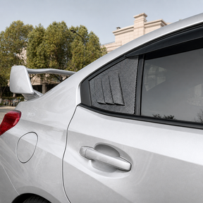 Aggressive carbon print rear side window louvers installed on a 2017 Subaru WRX STI